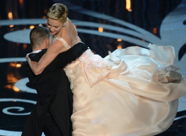 Actors Charlize Theron and Channing Tatum perform onstage at the show of the 85th Annual Academy Awards on February 24, 2013 in Hollywood, California. AFP PHOTO/Robyn Beck