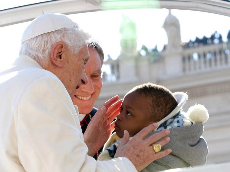 Pope Benedict XVI kisses a child as he arrives in St Peter's Square for his final general audience on February 27, 2013 in Vatican City, Vatican. The Pontiff attended his last weekly public audience before stepping down tomorrow. Pope Benedict XVI has...