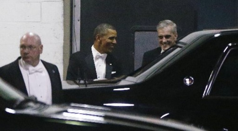 President Barack Obama walks with Chief of Staff Denis McDonough, right, as they leave the Gridiron Dinner through a loading area at a hotel in Washington, Saturday, March 9, 2013. (AP Photo/Charles Dharapak)