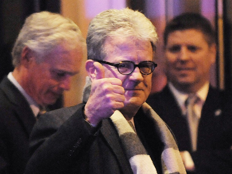 Sen. Tom Coburn gives a thumbs up as he leaves the Jefferson Hotel after a dinner with President Barack Obama. (Olivier Douliery-Pool/Getty Images)