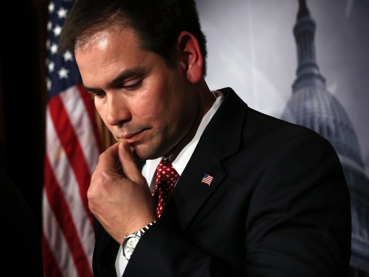 File Photo: U.S. Sen. Marco Rubio (R-FL) listens during a news conference on a comprehensive immigration reform framework January 28, 2013 on Capitol Hill in Washington, DC.  (Photo by Alex Wong/Getty Images, File)