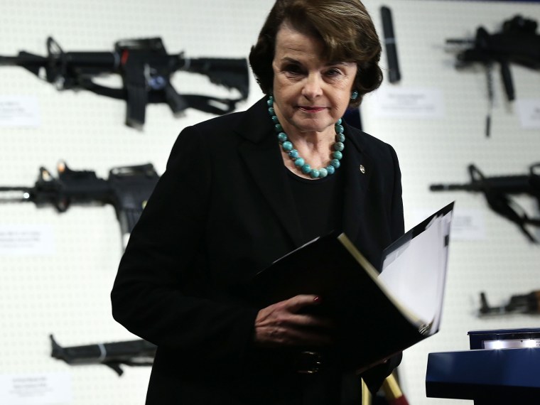 U.S. Sen. Dianne Feinstein (D-CA) stands next to a display of assault weapons during a news conference January 24, 2013 on Capitol Hill in Washington, DC. Feinstein sponsored a bill to ban assault weapons and high-capacity magazines capable of holding...