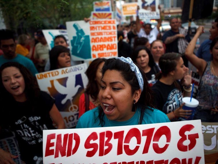 Protesting Arizona's Immigration Law SB 1070 in Phoenix, April 25, 2012. (Photo by Jonathan Gibby/Getty Images, File)