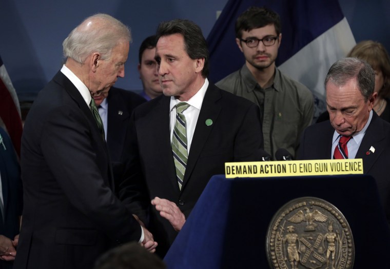 Vice President Joe Biden shakes hands with Neil Heslin, center, whose son Jesse Lewis died at the school shootings in Newtown, Conn., after Biden spoke in New York's City Hall Blue Room, Thursday, March 21, 2013. Relatives of shooting victims from...