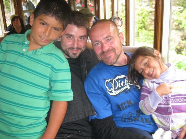 Daniel Martinez-Leffew (left) wrote a letter to Chief Justice Roberts, urging him to accept marriage equality. Shown from right to left: Daniel Martinez-Leffew, Bryan Leffew (father), Jay Foxworthy (father), Selena Leffew (sister) (Courtesy Bryan Leffew)