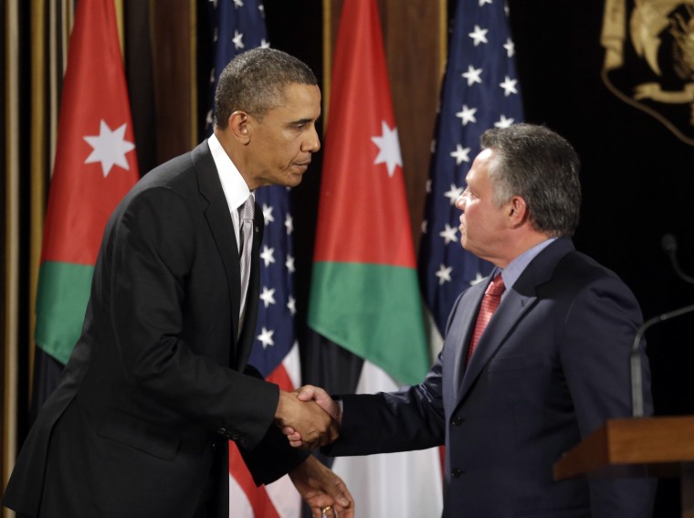 U.S. President Barack Obama, left, and Jordan's King Abdullah II, right, shake hands following their joint new conference at the King's Palace in Amman, Jordan, Friday, March 22, 2013. (AP Photo/Pablo Martinez Monsivais)