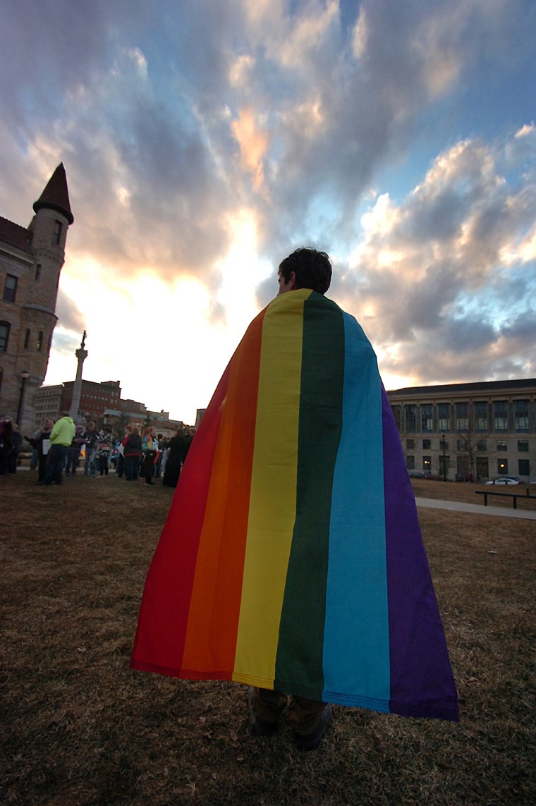 Daniel Wales, 21, of Clarks Summit, Pa. wears a Pride flag as a cape during a Scranton Candlelight Vigil for Marriage Equality in advance of the Supreme Court DOMA  (AP Photo/The Scranton Times-Tribune, Butch Comegys)