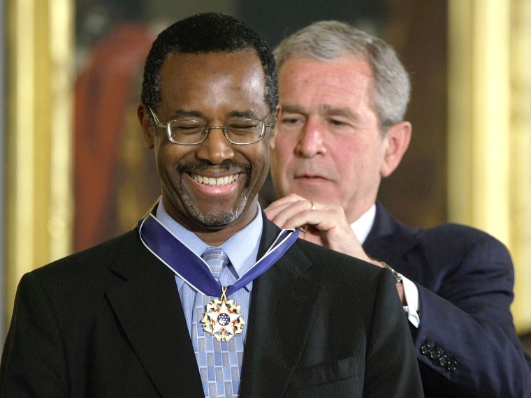 File Photo: U.S. President George W. Bush (R) presents a Presidential Medal of Freedom to Benjamin S. Carson, Sr. M.D (L), for his work with neurological disorders during an East Room ceremony June 19, 2008 at the White House in Washington, DC.  The...
