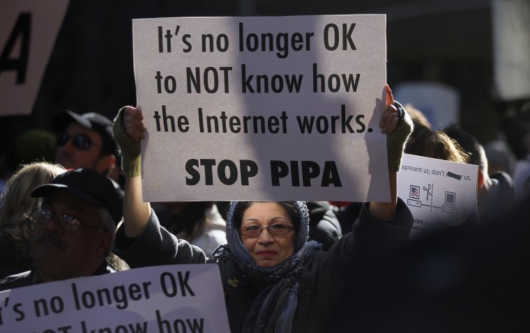Protesters demonstrate against the proposed Stop Online Piracy Act (SOPA) and Protect IP Act (PIPA) outside the offices of U.S. Sen. Charles Schumer (D-NY) and U.S. Sen. Kirsten Gillibrand (D-NY) on January 18, 2012 in New York City.  The controversial...