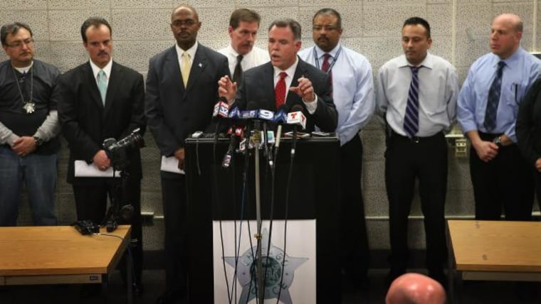 With police officers who solved the case behind him, Chicago Police Superintendant Garry McCarthy announces arrests have been made in the murder of 15-year-old Hadiya Pendleton during a press conference at Area Central on February 11, 2013 in Chicago,...