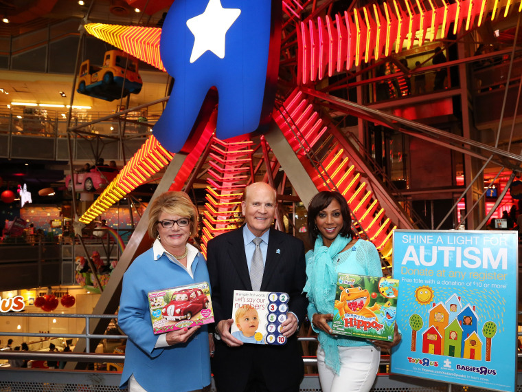 (L-R) Autism Speaks Co-founders Suzanne Wright and Bob Wright and Autism Speaks board member Holly Robinson Peete help kick off the organization's Light it Up Blue campaign at Toys\"R\"Us Times Square on April 1, 2013 in New York City.  The Light it Up...