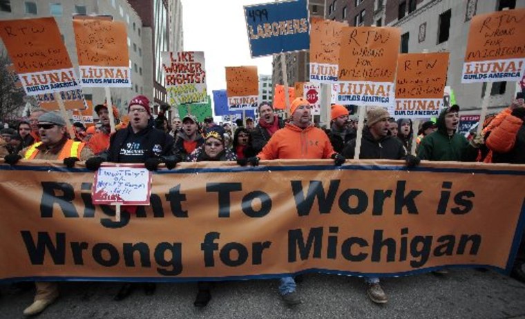 Union members and supporters march to the Michigan State Capitol building to protest against right-to-work legislation in Lansing, Michigan December 11, 2012. (REUTERS/Rebecca Cook)