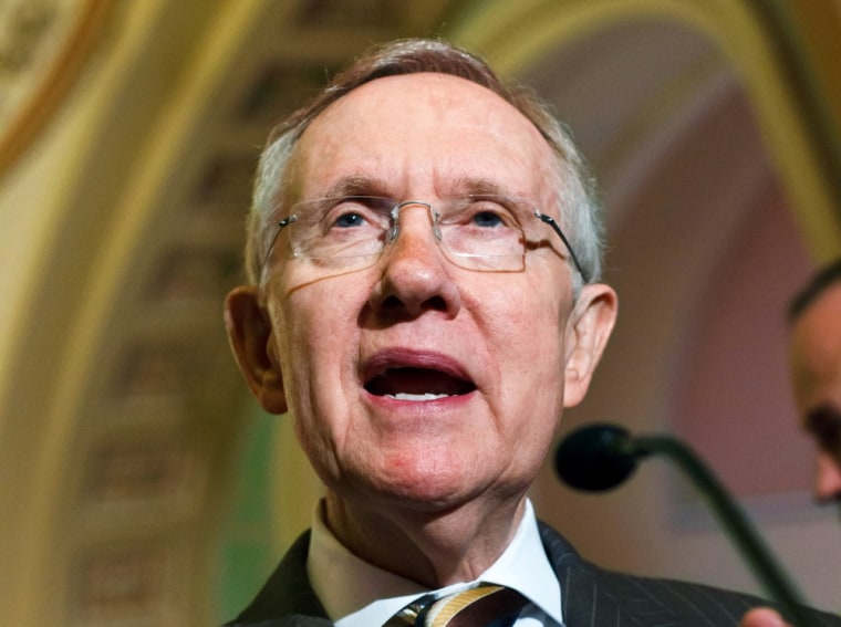 Senate Majority Leader Harry Reid announces to reporters on Capitol Hill July 31 that lawmakers have reached an agreement to keep the government running on autopilot for six months when the current budget year ends on Sept. 30.