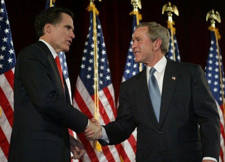 President Bush, right, shakes hands Massachusetts Gov. Mitt Romney at a Bush-Cheney 2004 campaign fundraising event in Boston Thursday, March 25, 2004.