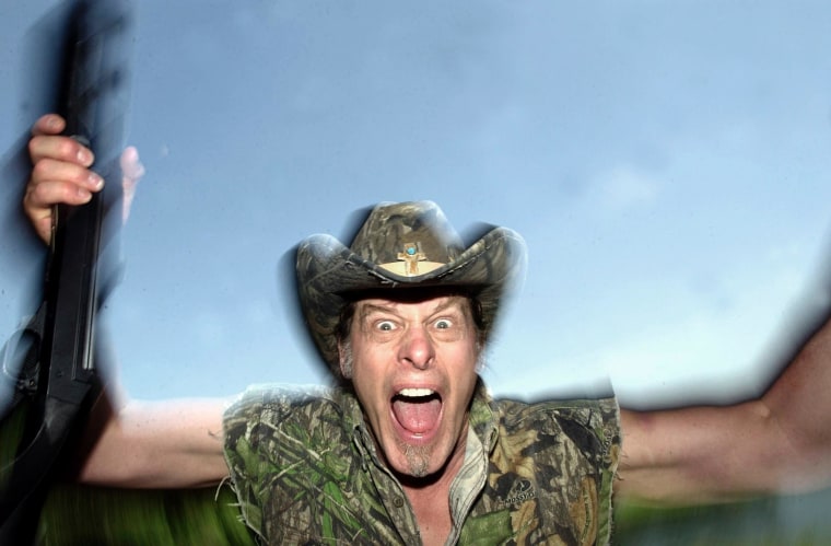 In this file photo Ted Nugent screams for a photo at his ranch near Crawford, Texas, Friday, April 22, 2005.