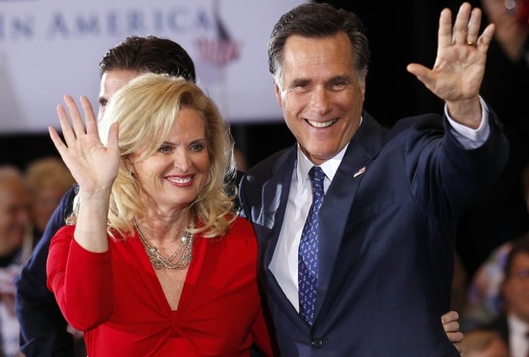Republican presidential candidate, former Massachusetts Gov. Mitt Romney, waves to supporters with his wife Ann at his election watch party after winning the Michigan primary in Novi, Mich., Tuesday, Feb. 28, 2012.
