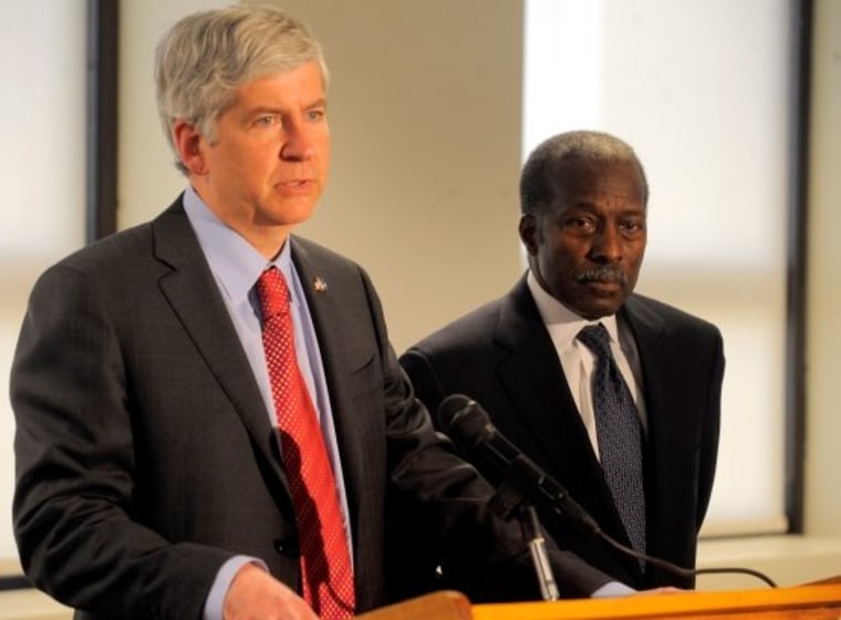 Michigan Gov. Rick Snyder, a Republican, named Roy S. Roberts, right, a former vice president of General Motors Corp., as the next emergency manager of the troubled Detroit Public Schools during a press conference on May 4, 2011, at Cadillac Place in...