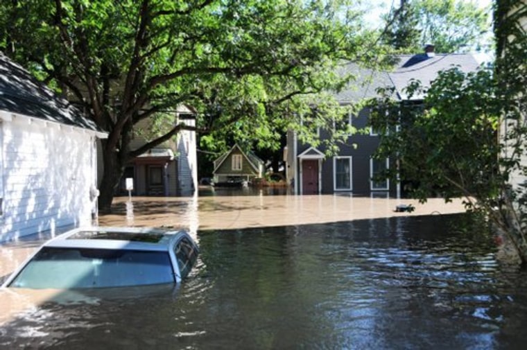 A car is submerged in Schenectady, New York's Stockade district.