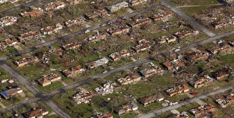 This aerial photo shows a neighborhood destroyed by the powerful tornado in Missouri.  The tornado moved through much of the city Sunday, damaging a hospital and hundreds of homes and businesses and killing at least 122 people.
