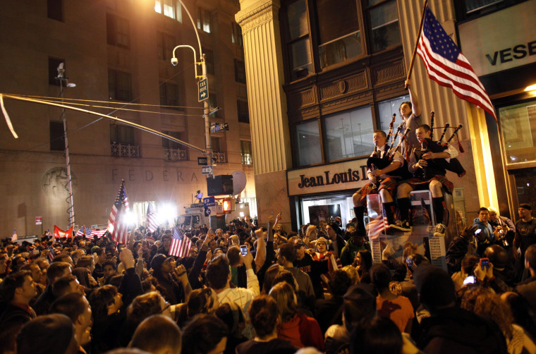 A large crowd reacts to the news of Osama Bin Laden's death at the corner of Church and Vesey Streets, adjacent to ground zero after President Barack Obama announced Sunday night that Osama bin Laden was killed in an operation led by the United States.