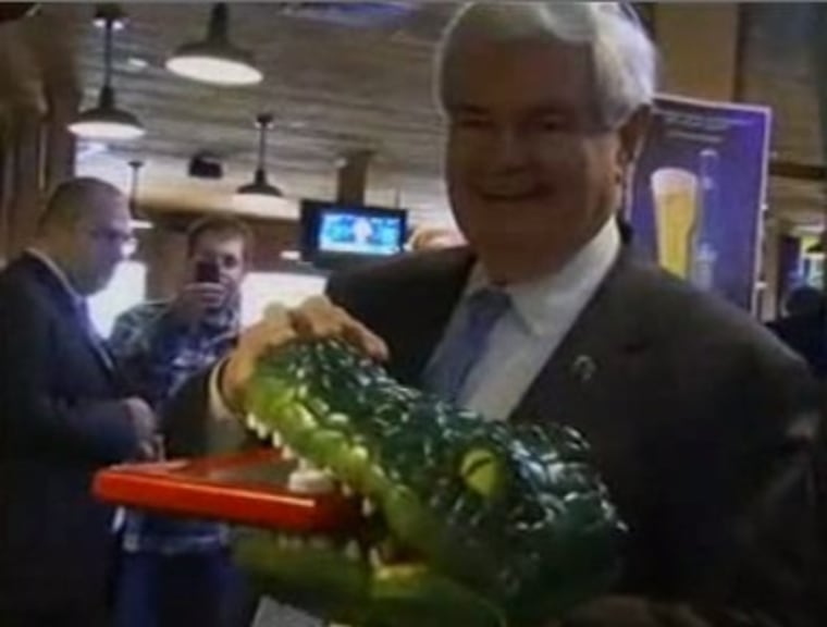 Gingrich shakes up the Etch A Sketch jokes with an alligator
