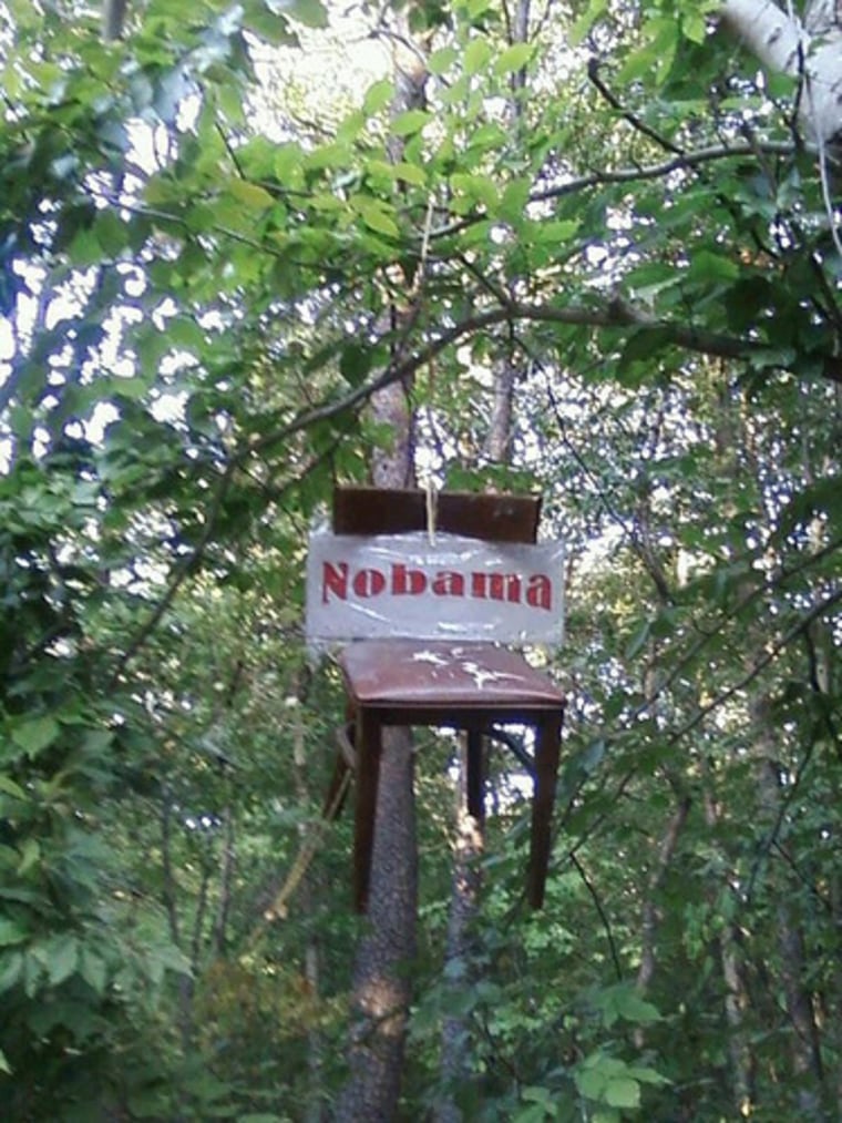 A chair with an anti-Obama slogan hangs from a tree in Centreville, Va.