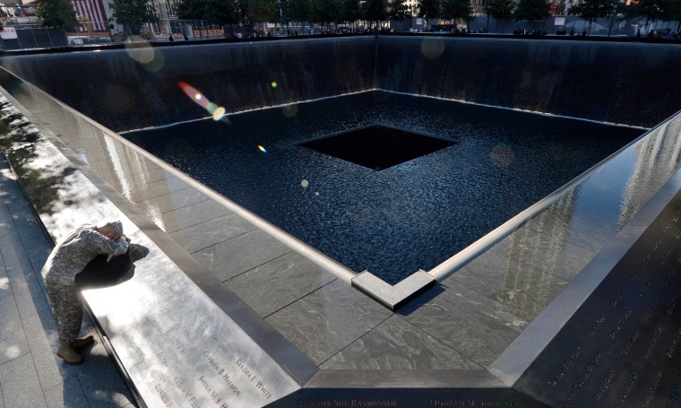 Scott Willens, who joined the U.S. Army three days after the terrorist attacks of 9/11, pauses by the South Pool during memorial ceremonies for the 11th anniversary of the terrorist attacks at the World Trade Center site in New York City.