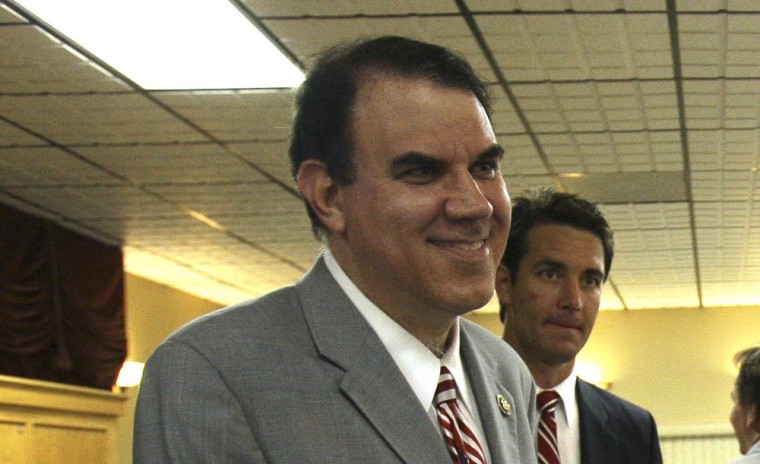 Rep. Alan Grayson, left, D-Fla., greets supporters after a town hall meeting on health care in Tavares, Fla., Monday, Oct. 12, 2009.
