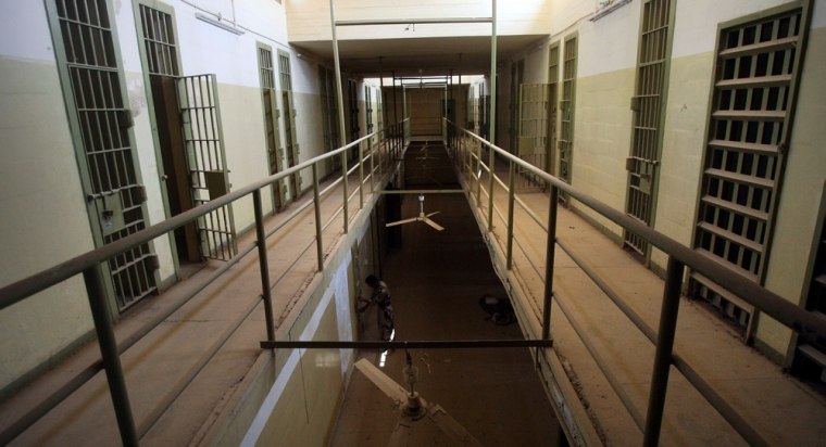 An Iraqi army soldier looks at the cells of the Abu Ghraib prison, after taking charge from U.S. soldiers, on the outskirts of Baghdad, Iraq,Saturday Sept.2, 2006.Iraq's government has formally taken over the notorious prison.