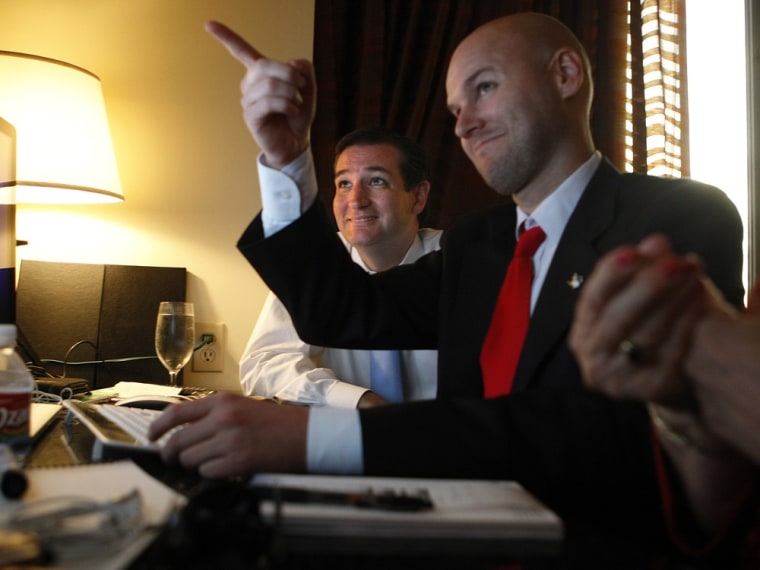 Ted Cruz, left, and his general consultant Jason Johnson look at early returns in his war room at the JW Marriott in the Galleria during his runoff election on July 31, 2012, in Houston.