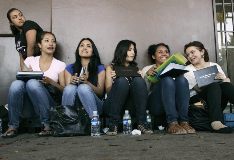 Students wait in line for assistance with paperwork for the Deferred Action for Childhood Arrivals program at the Coalition for Humane Immigrant Rights of Los Angeles in Los Angeles, California, August 15, 2012.