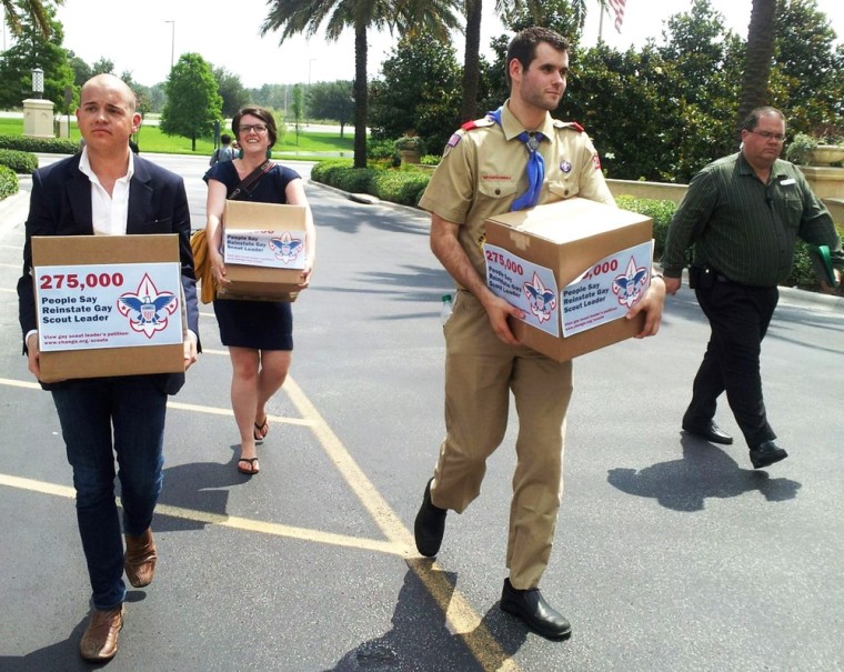 Eagle Scout Zach Wahls (2nd R) delivers cartons of 275,000 petitions to the Boys Scouts of America national board meeting in Orlando, May 30, 2012, calling for an end to anti-gay discriminatory practices.