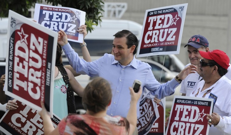 Ted Cruz, center, greets supporters at a Houston voting precinct on election day, July 31, 2012.
