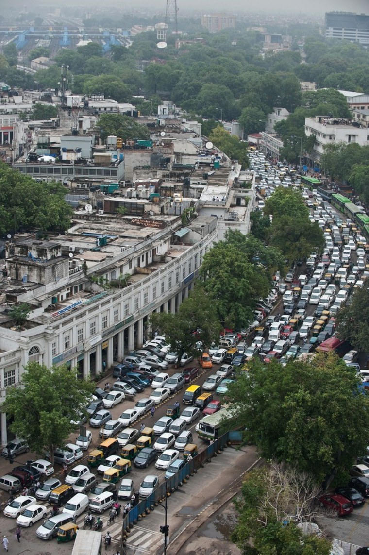 Traffice crawls in Connaught Place in New Delhi July 31 as the traffic flow worsened in the afternoon after signals stopped functioning following a failure in the Northern Power Grid.