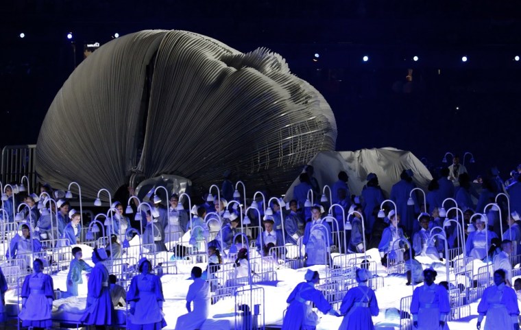 Actors perform in a sequence meant to represent Britain's National Health Service (NHS) during the opening ceremony at the 2012 Summer Olympics, Friday, July 27, in London.