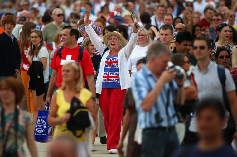 A Great Britain fan cheers outside Olympic Stadium before the opening ceremony on July 27.
