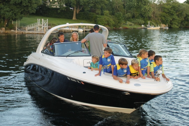 Republican presidential candidate Mitt Romney, rear left, and his wife Ann, with their grandchildren in the bow of their boat, depart from the public docks on Lake Winnipesaukee in Wolfeboro, N.H., Monday, July 2.