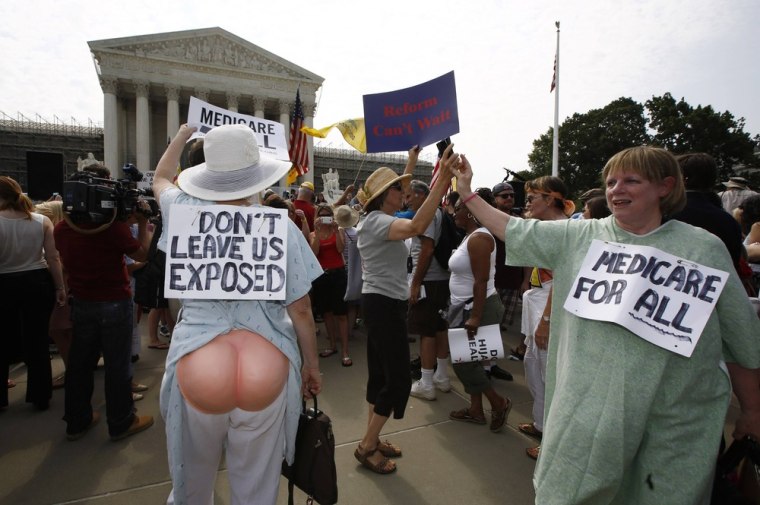 Supporters of U.S. President Barack Obama's 2010 healthcare overhaul react outside the Supreme Court in Washington June 28, 2012.