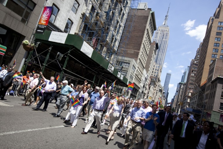 New York Mayor Michael Bloomberg (C), NYC Council Speaker Christine Quinn (C-L) and Sen. Kirsten Gillibrand (C-R) march down Fifth Avenue during the New York City gay pride march.