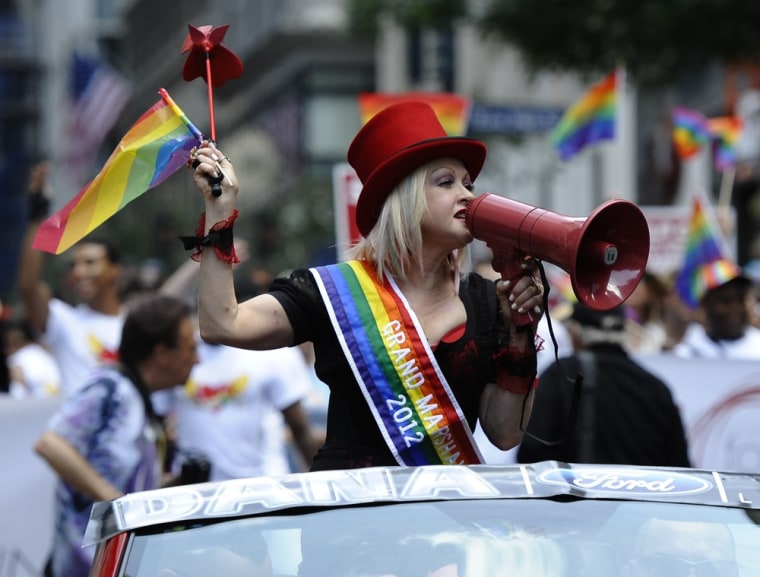 Cyndi Lauper, the grand marshall of the 43rd annual New York City gay pride parade, rides down 5th Avenue.