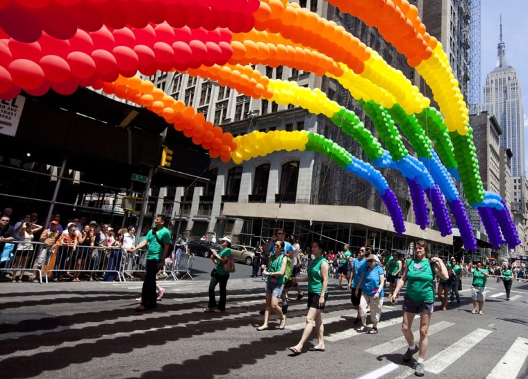 Rainbow balloons make their way down Fifth Avenue during the New York City gay pride march June 24, 2012.