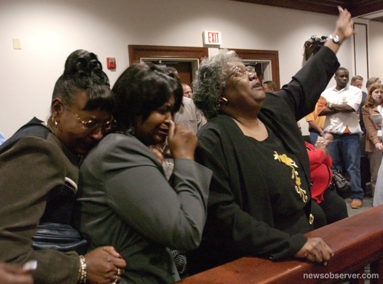 Sylvester Smith's wife Phillis Smith, right, reacts as Judge William Gore announced that Smith would be granted a new trial after two witnesses recanted their testimony in Bolivia, N.C., Nov. 5, 2004.