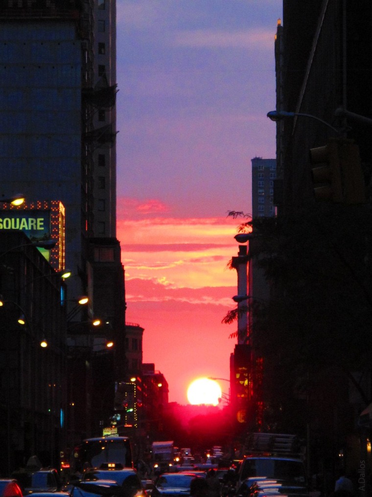 Clouds part for Manhattanhenge pilgrims