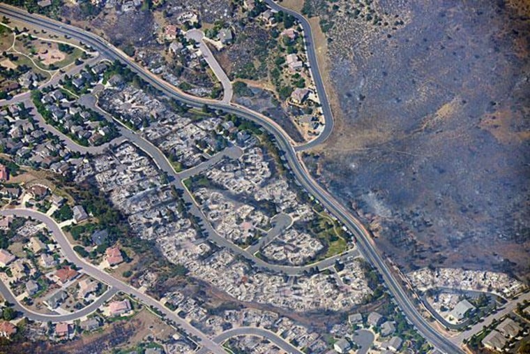 An aerial photo taken Wednesday of burned homes in a residential area of Colorado Springs.