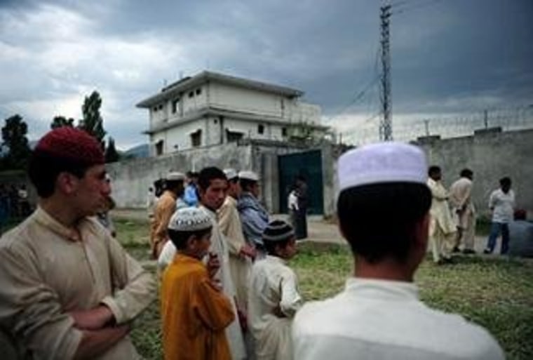 Pakistani students gather in front of Osama bin Laden's compound in Abbottabad.