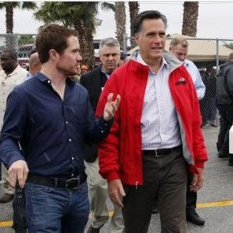 Romney at a NASCAR event, doing his best imitation of a normal person.