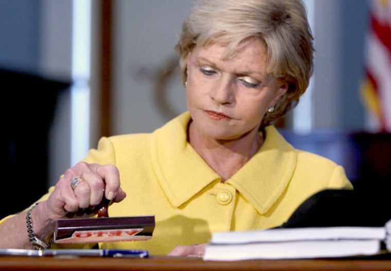 Gov. Bev Perdue with her veto stamp