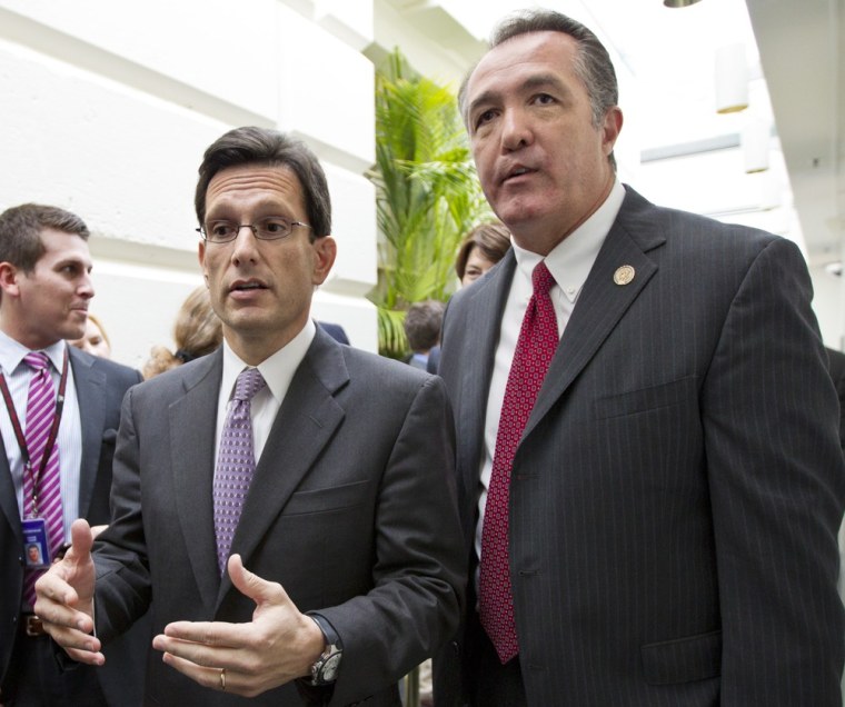 House Majority Leader Eric Cantor, R-Va., left, confers with Rep. Trent Franks, R-Ariz., right, following a weekly House GOP strategy session, at the Capitol in Washington.