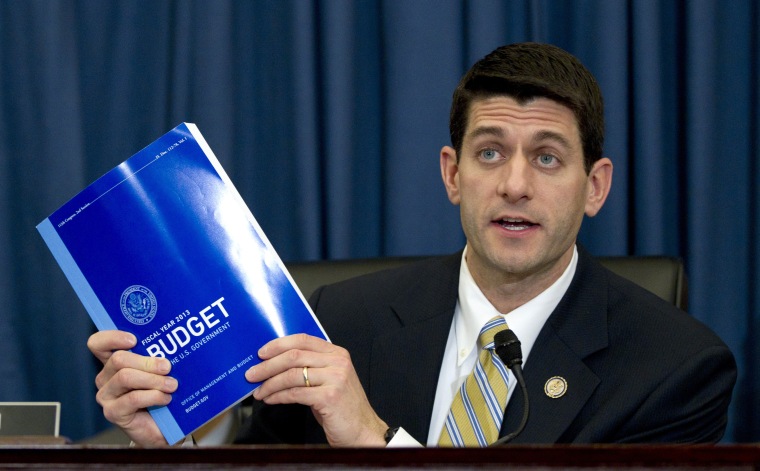 In this Feb. 16, 2012, file photo House Budget Committee Chairman Rep. Paul Ryan, R-Wis., holds up a copy of President Barack Obama's fiscal 2013 federal budget during the budget committee's hearing on Capitol Hill in Washington. After a few months of...