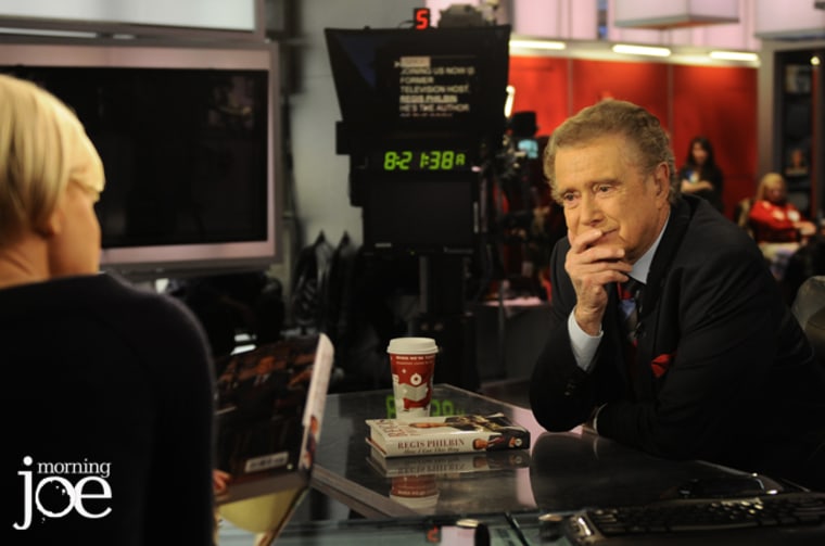 Regis Philbin talks with Mika Brzezinski on the set of Morning Joe